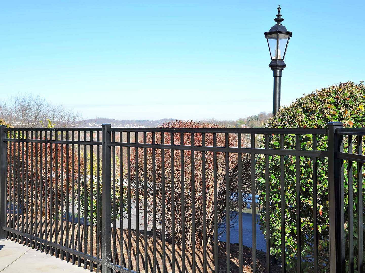 Aluminum 3 rail fence installed in a residential area by a fence company in Western Pennsylvania