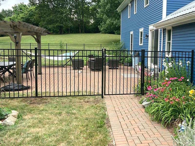 3 rail aluminum fence with gate installed around a back porch in Western Pennsylvania