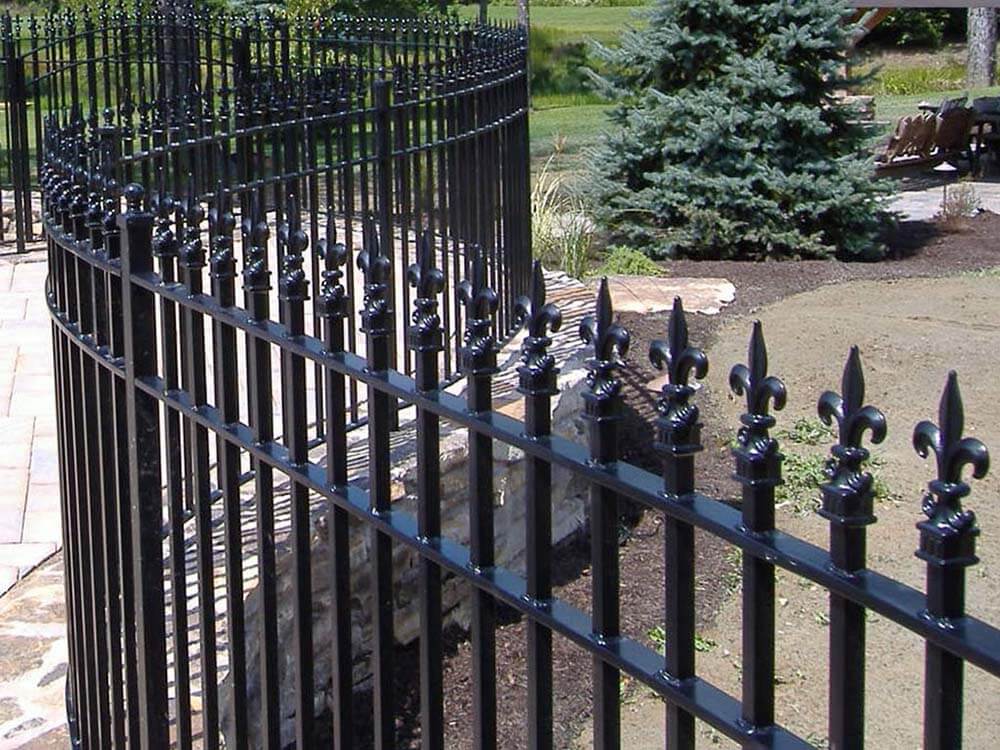 Ornate extended picket aluminum 3 rail fence installed around a residential home in Western PA