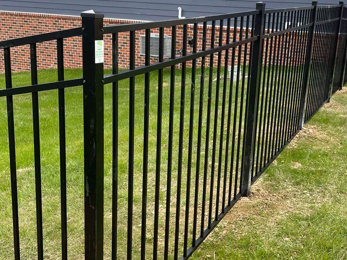 3 rail aluminum fence around a yard installed for a residential property in Western Pennsylvania