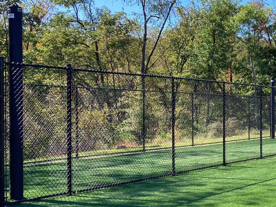 Black chain link fence installed on a commercial property