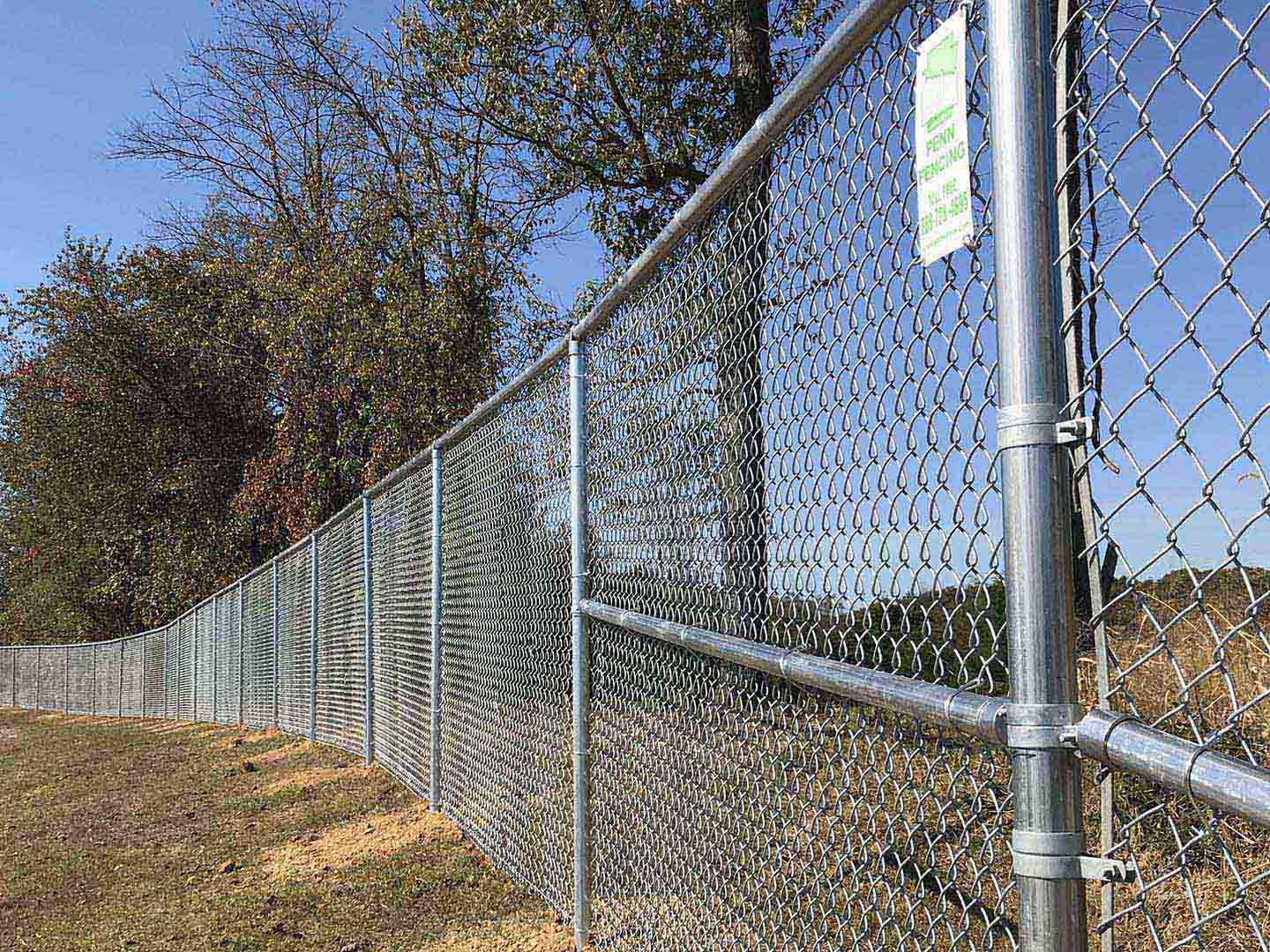 Galvanized chain link boundary fence installed by a local fence company in Butler Pennsylvania