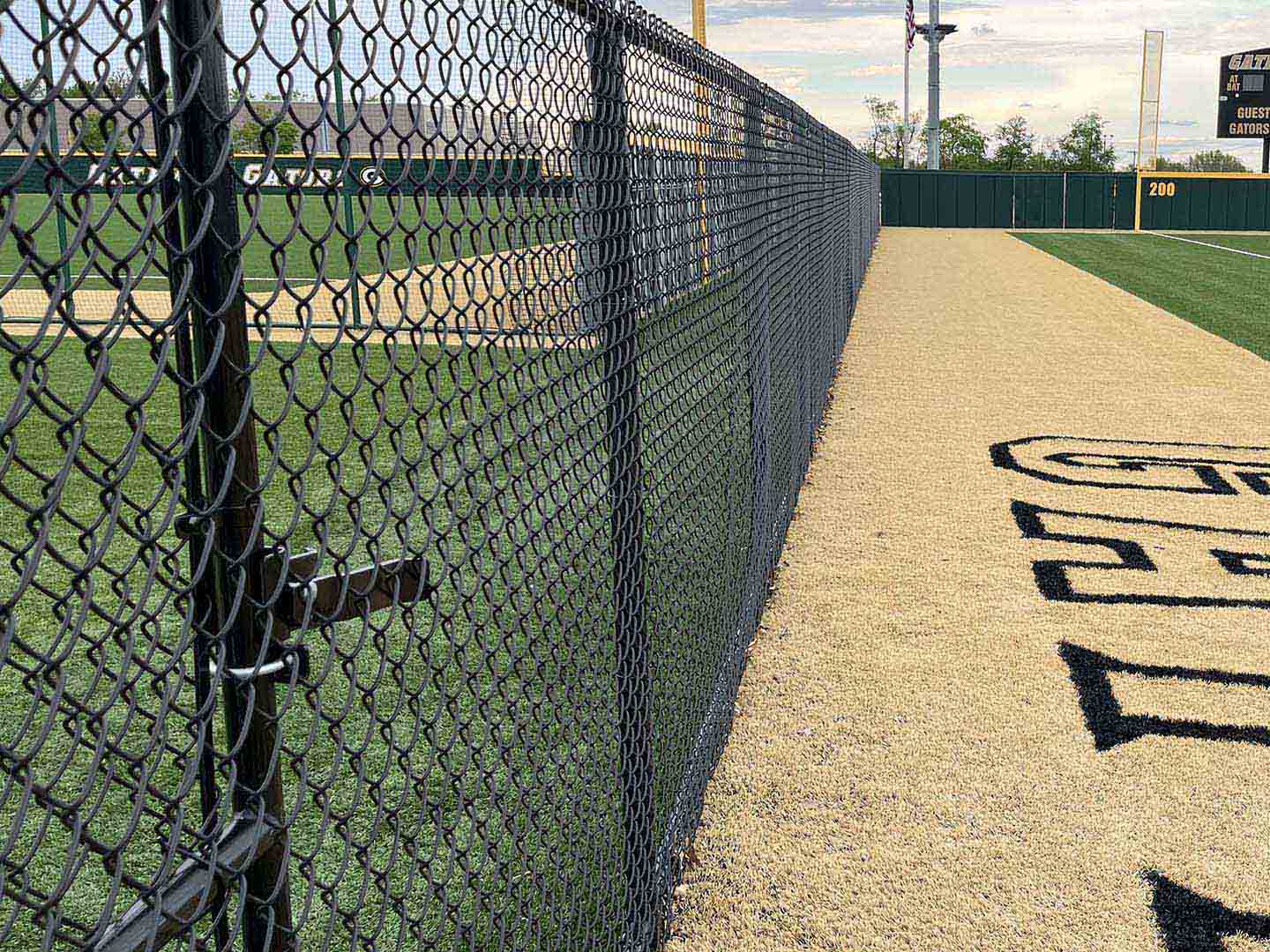 Black chain link fence for a sports field installed in Butler Pennsylvania