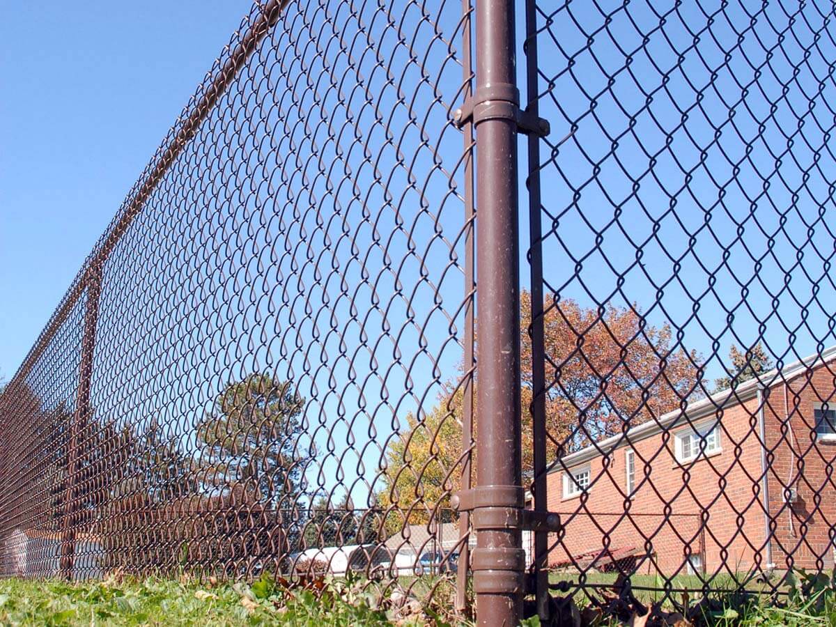 Brown chain link fence installed around a commercial property in Western Pennsylvania