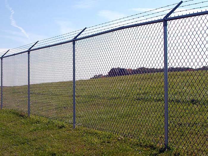 Commercial chain link fence with barbed wire installed in Western Pennsylvania