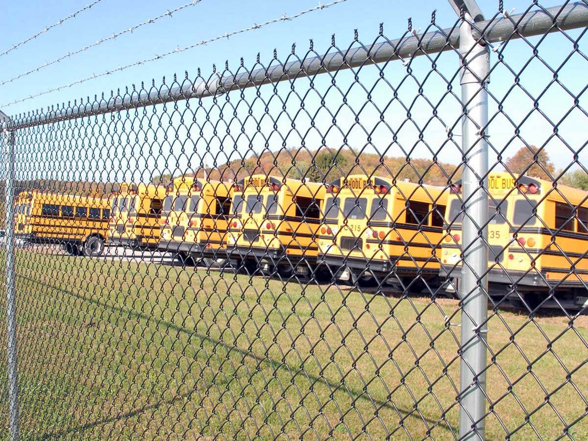 Commercial chain link fence installed for a bus parking lot in Western Pennsylvania