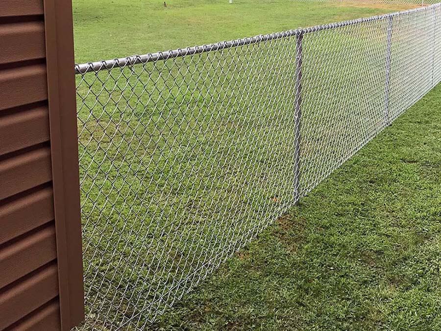 Chain link fence installed in Western Pennsylvania next to a building