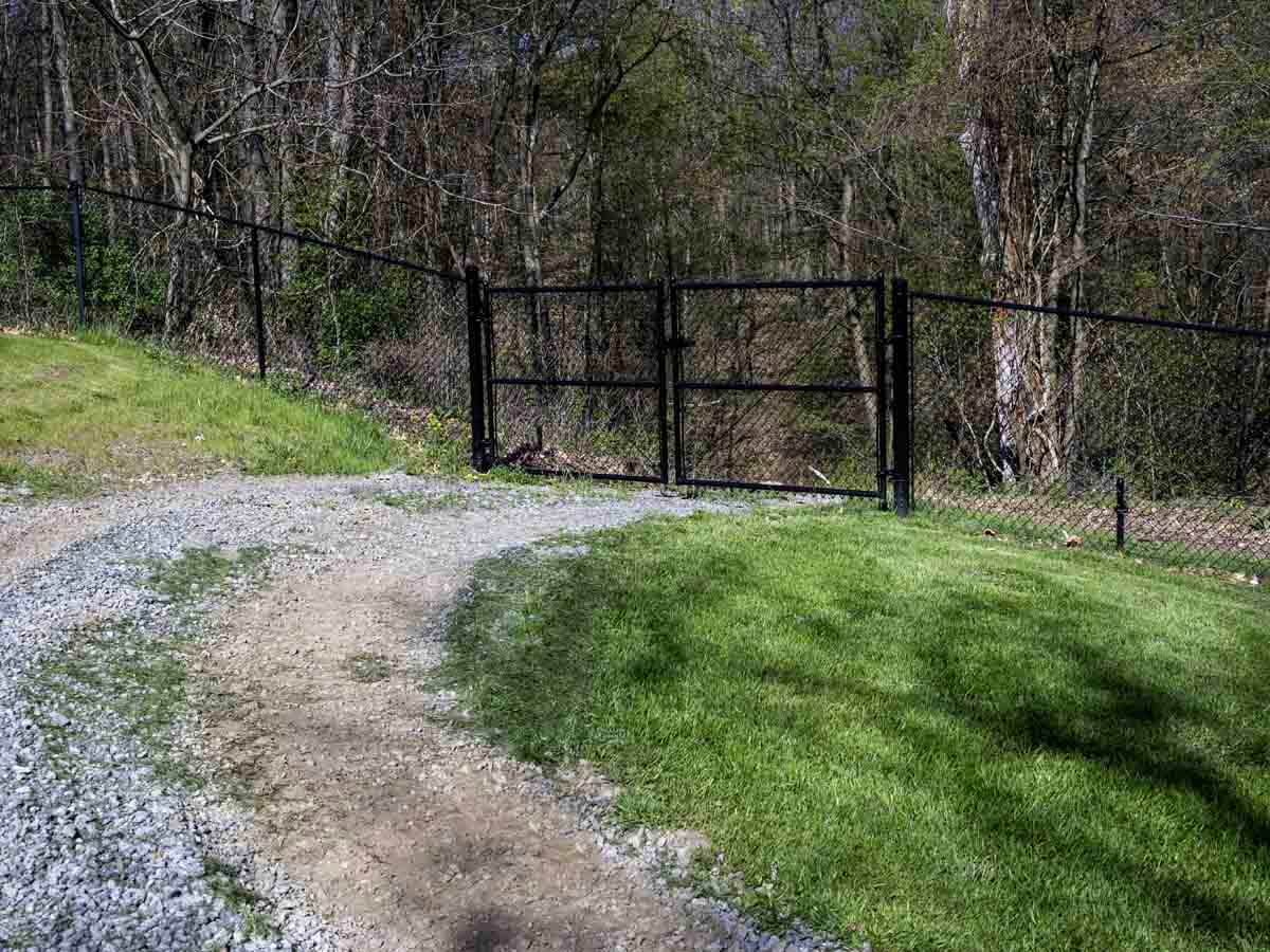 Black chain link fence with double swing gate installed in Western Pennsylvania