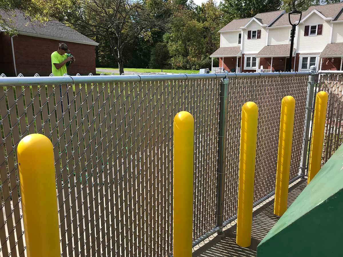 Commercial Chain Link Fence Installed with Safety Bollards in Western Pennsylvania