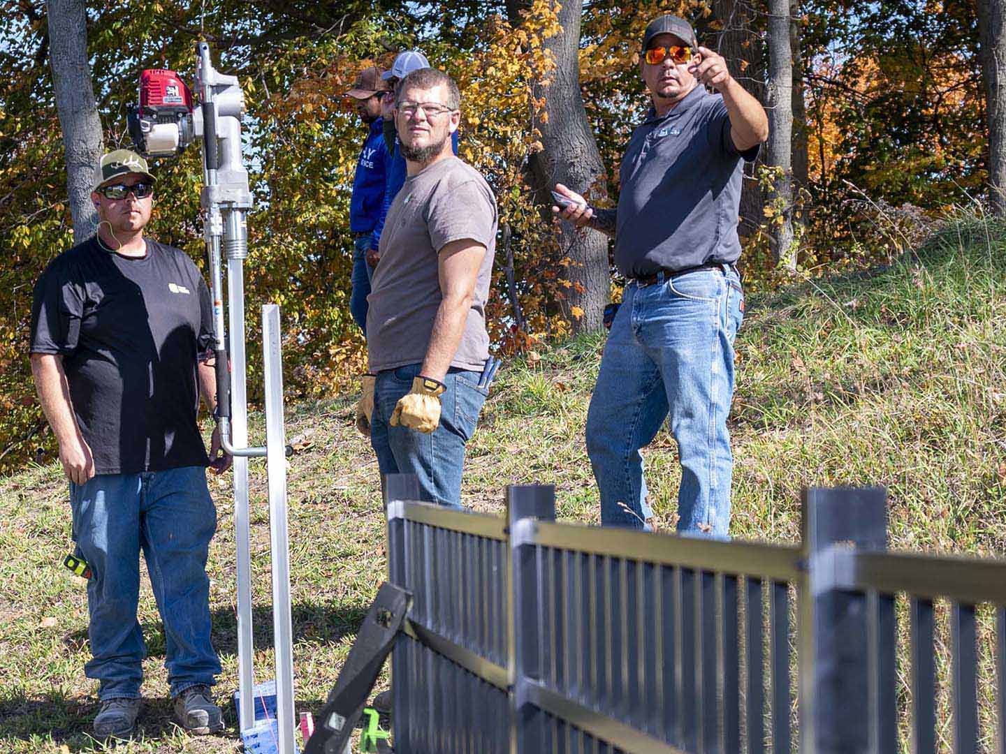 Penn Fencing Company employees working on an aluminum fence install in Butler Pennsylvania