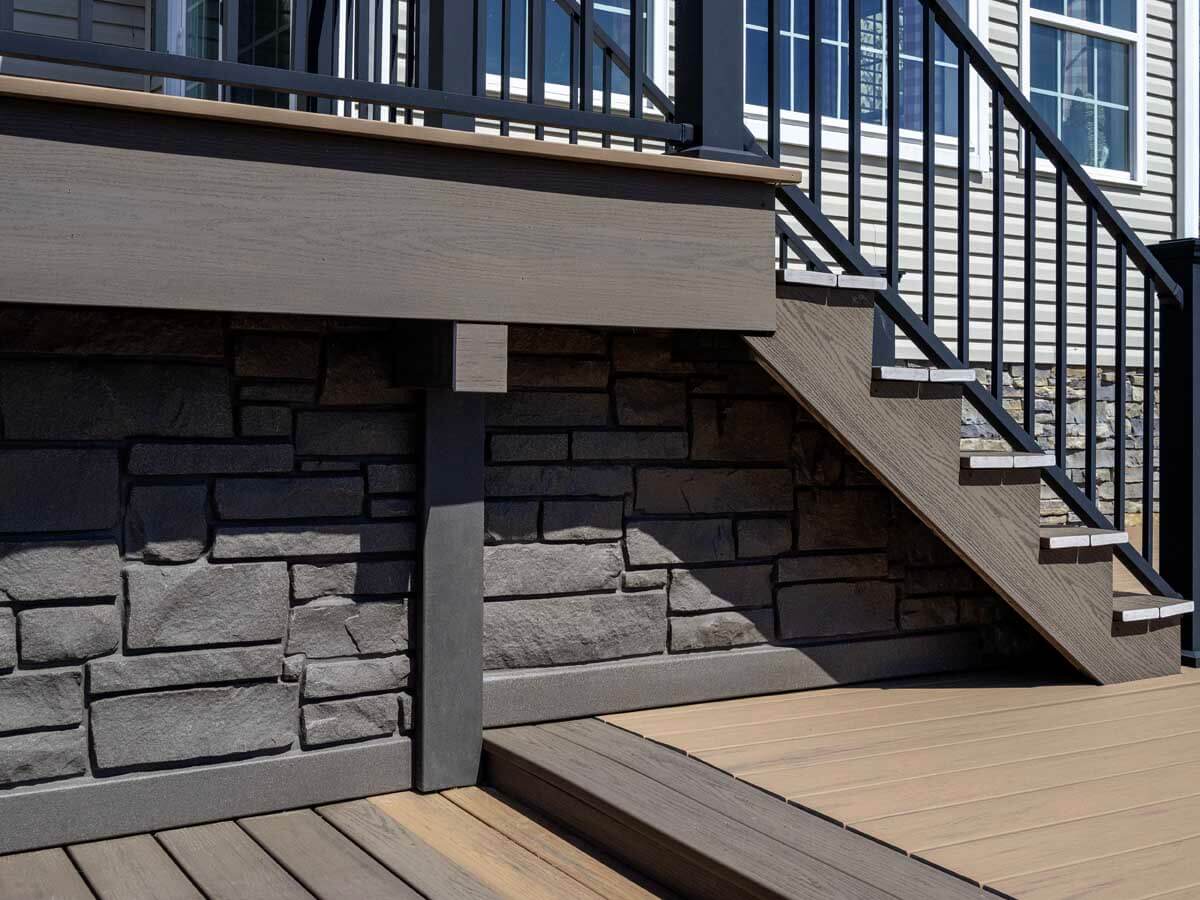 Deck installation with stairs and railings for a residential home in Western Pennsylvania