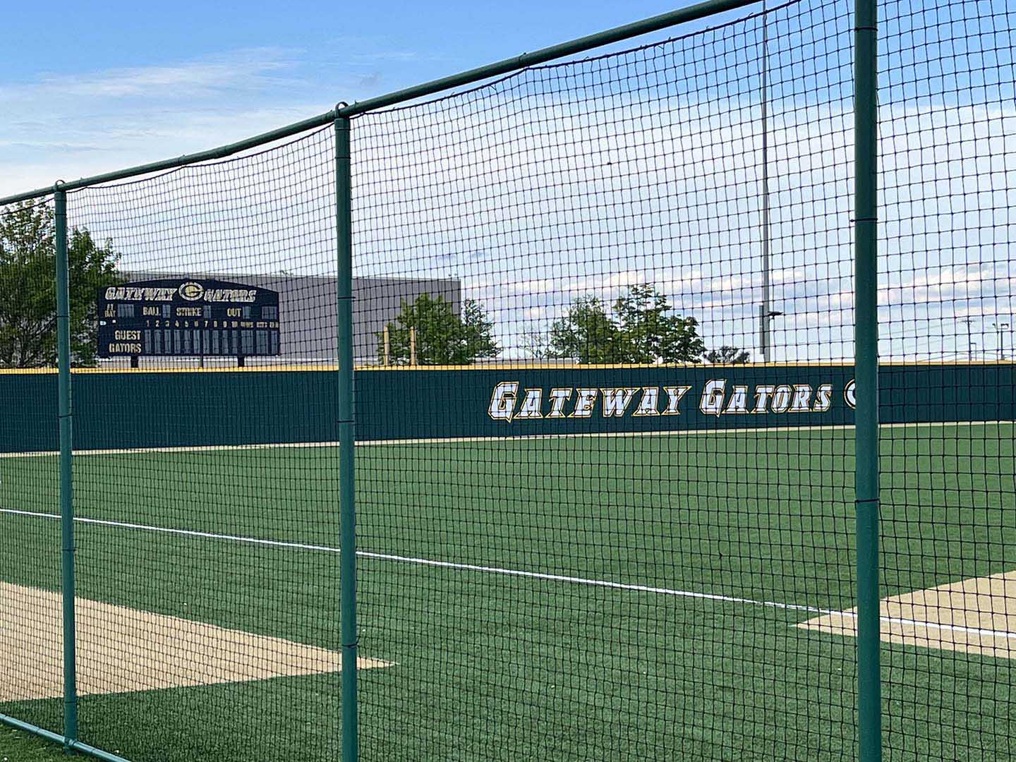 Green netting fence installed on sports field by a fence company in Butler Pennsylvania
