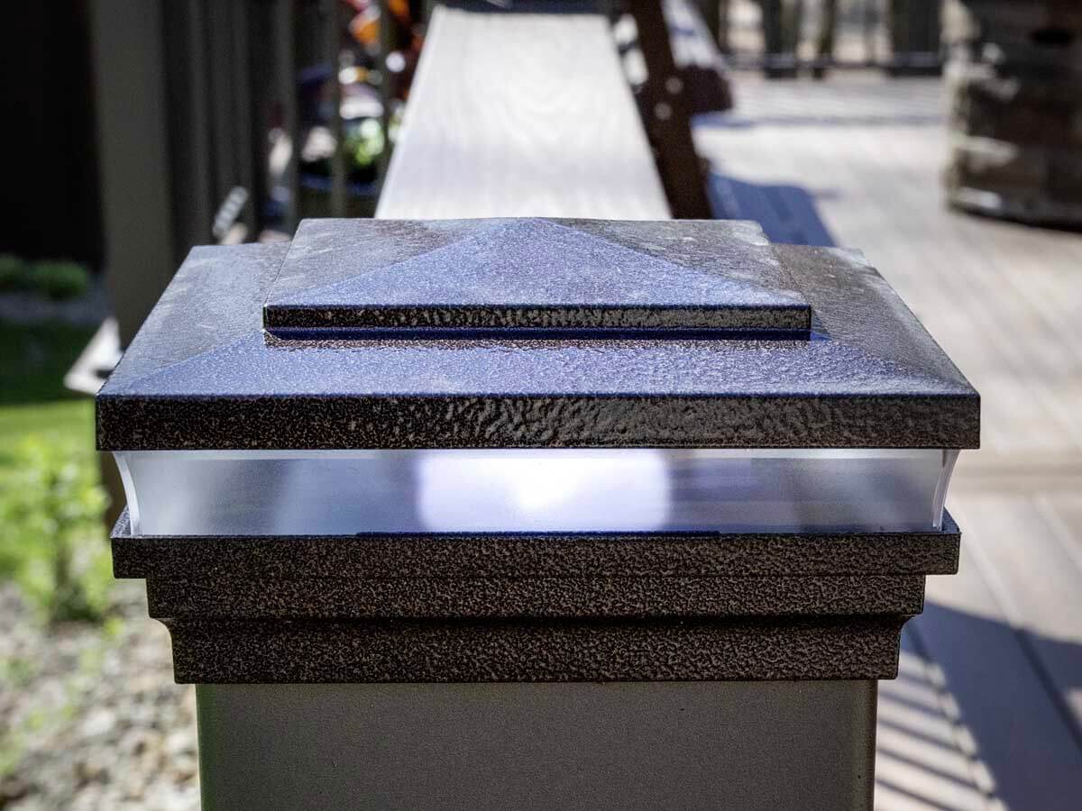 Lighted post caps installed along aluminum railings for a deck in Western PA