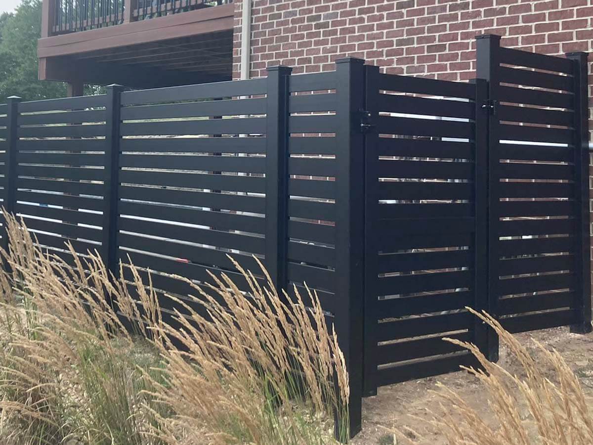 Horizontal black sleek fence installation for a residential property in Butler Pennsylvania