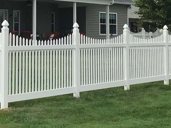White stepped picket vinyl fence installed on a residential property in Butler Pennsylvania
