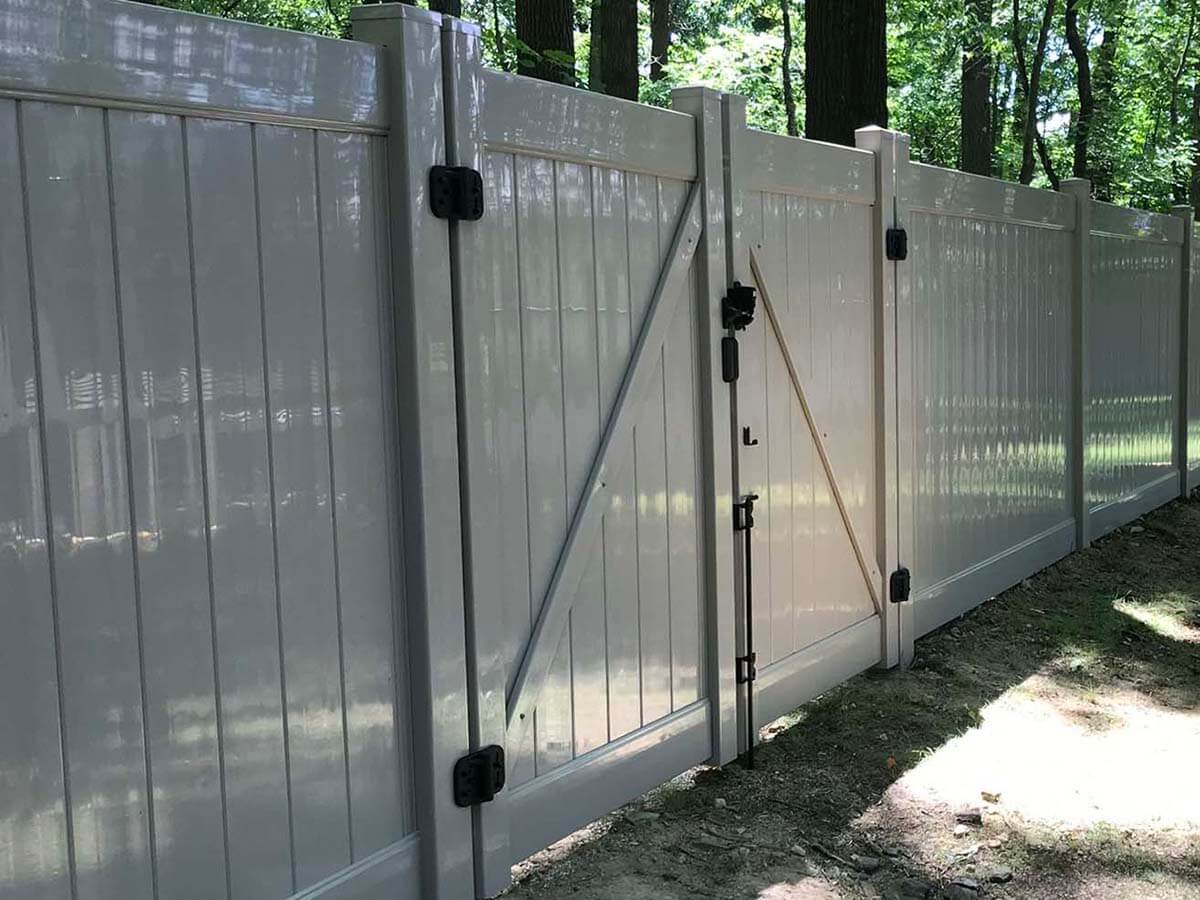 Full privacy vinyl fence with gate installed in Butler Pennsylvania