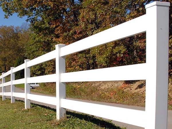 Post and rail vinyl fence installed around a residential property in Western Pennsylvania