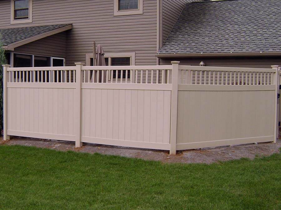 Spindle top vinyl fence installed around a back yard in Western Pennsylvania