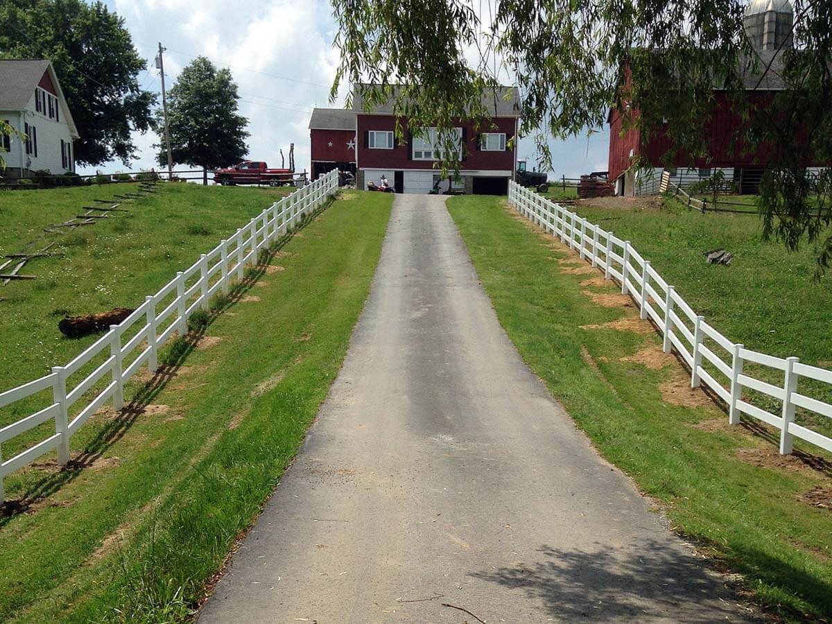 3 rail vinyl fence installed along a drive way to a home in Western Pennsylvania