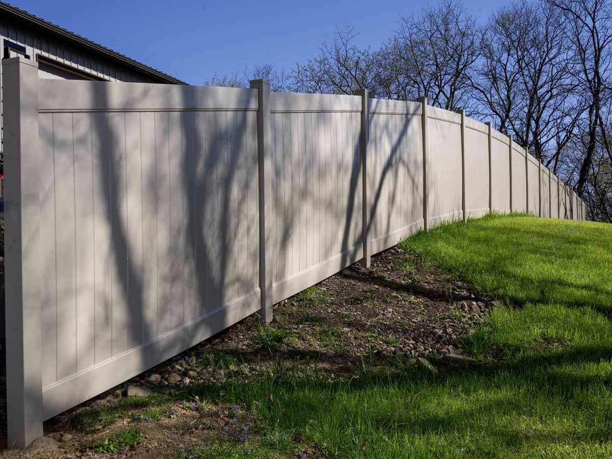 Full privacy white vinyl fence installed around a home in Western Pennsylvania