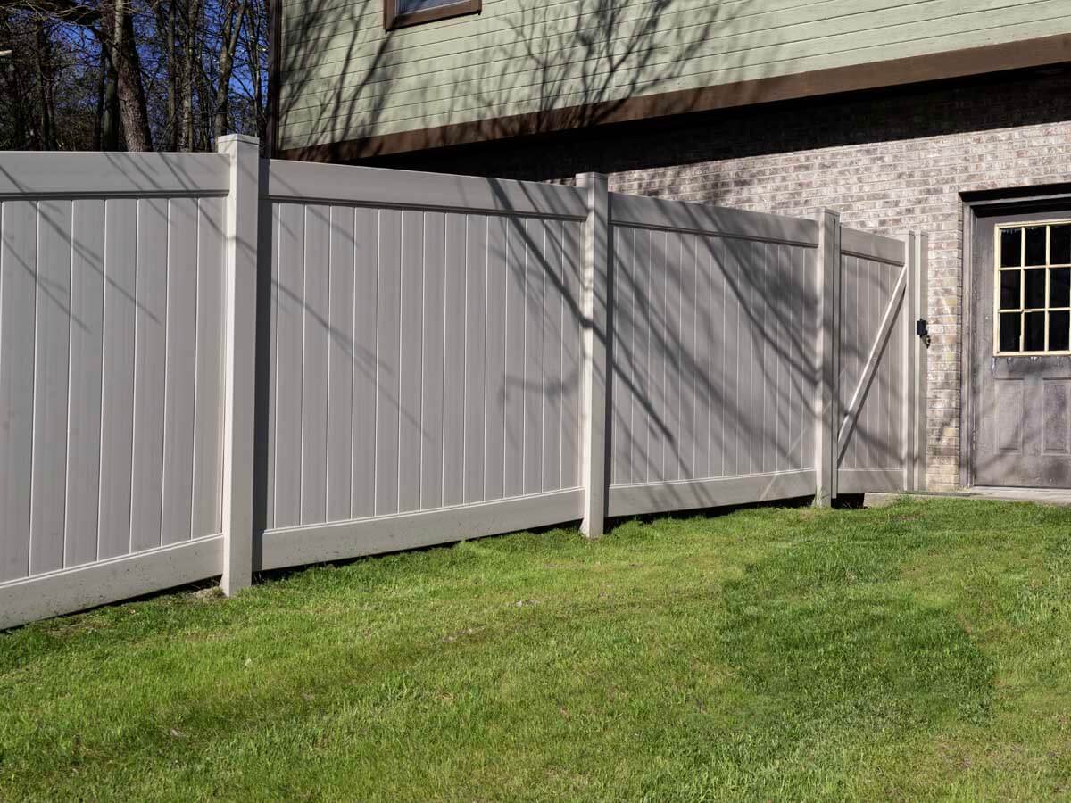 White vinyl fence and gate installed for a residential property in Western Pennsylvania