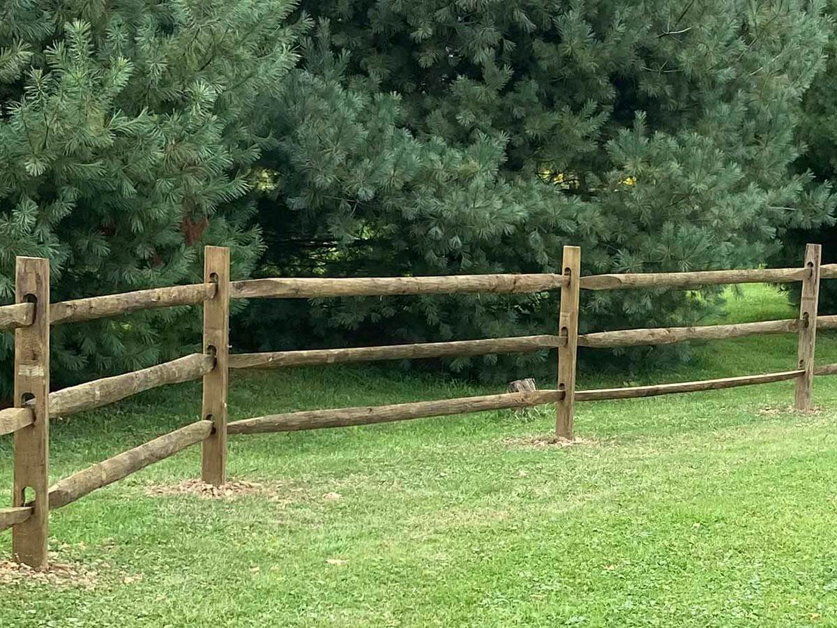 Split rail wood fence for a residential property installed in Butler Pennsylvania