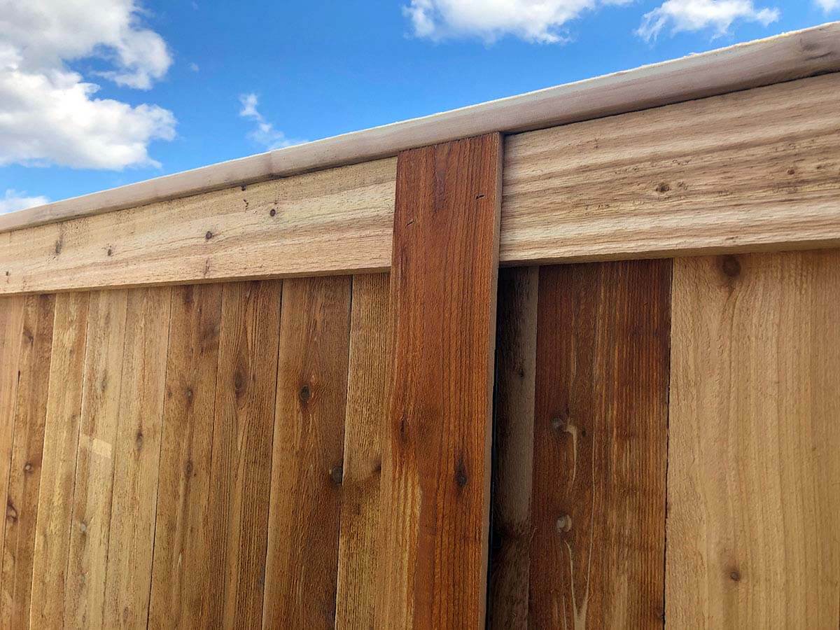 Full privacy wood fence with cap and trim installed in Western PA